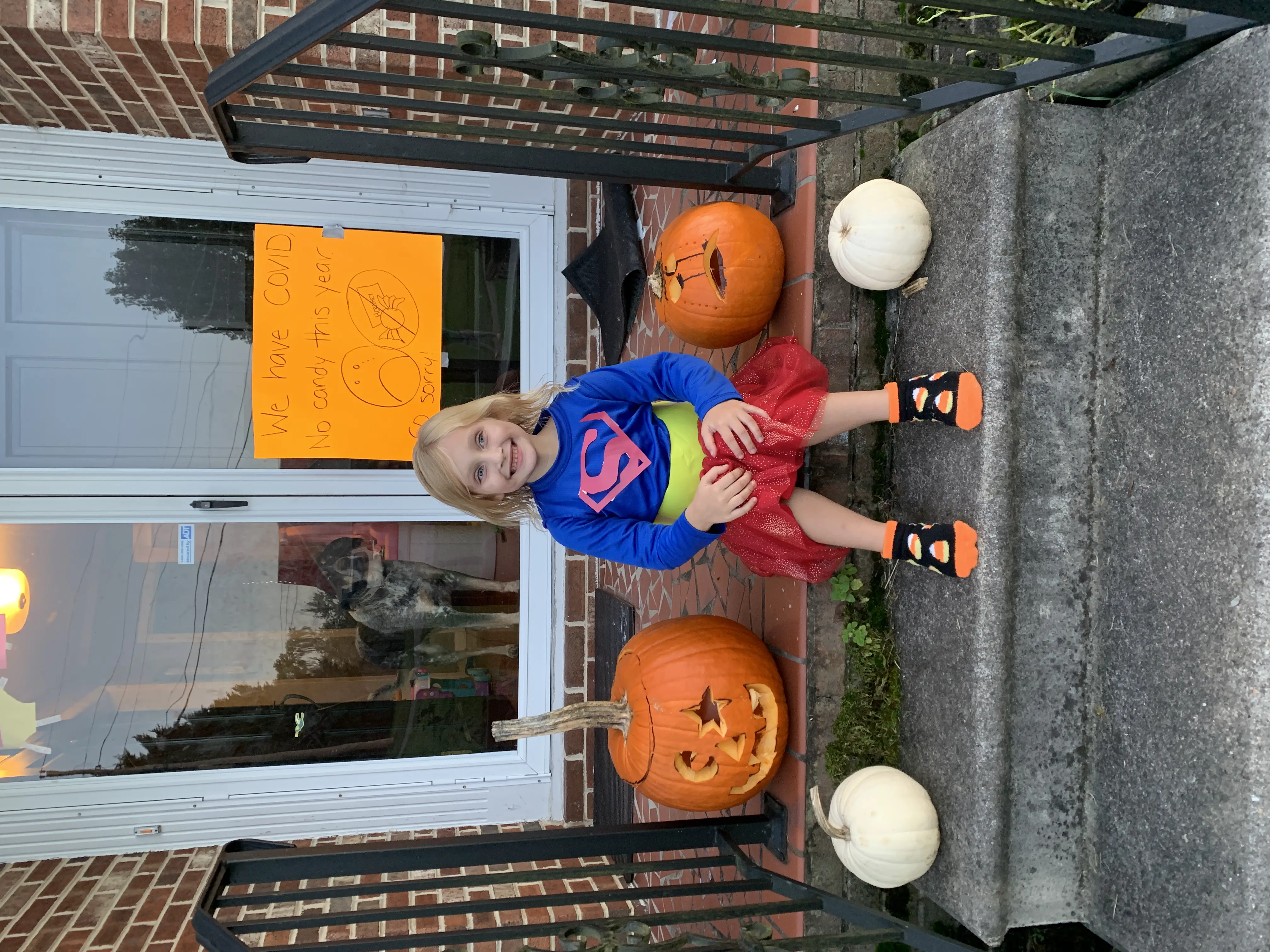 COVID Halloween - girl on porch with no candy sign