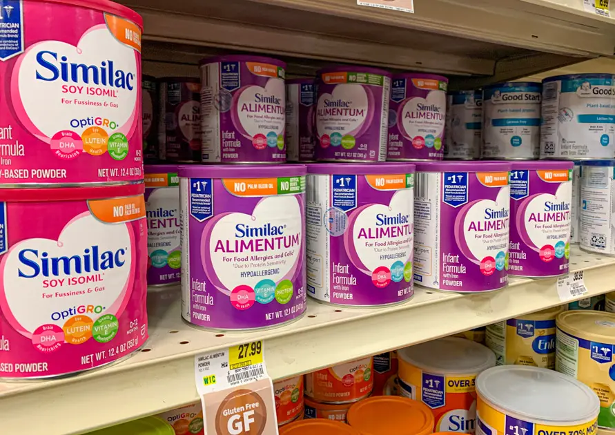 Different kinds of baby formula lined up at the store